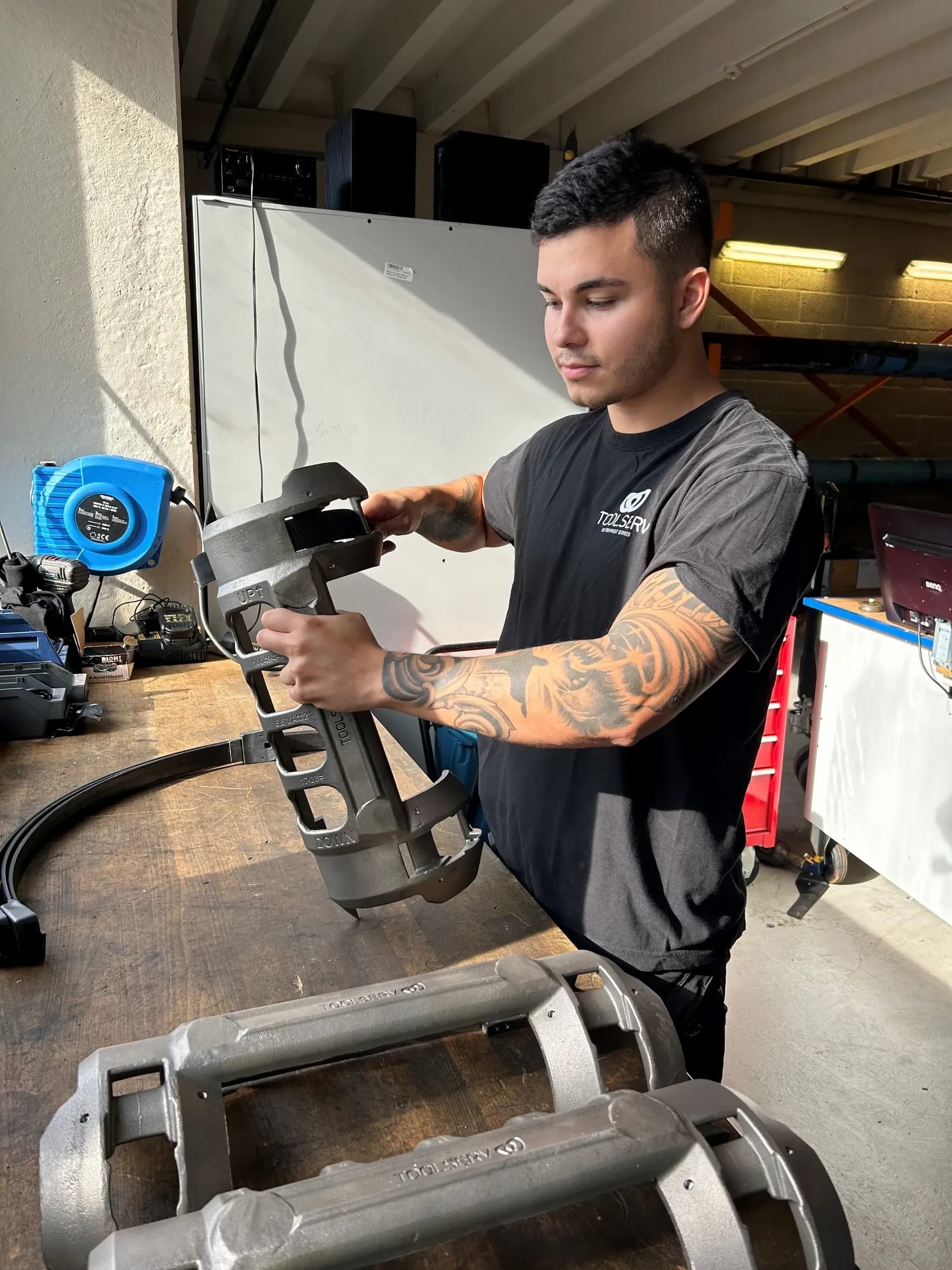 Employee assembling F1 cable clamp